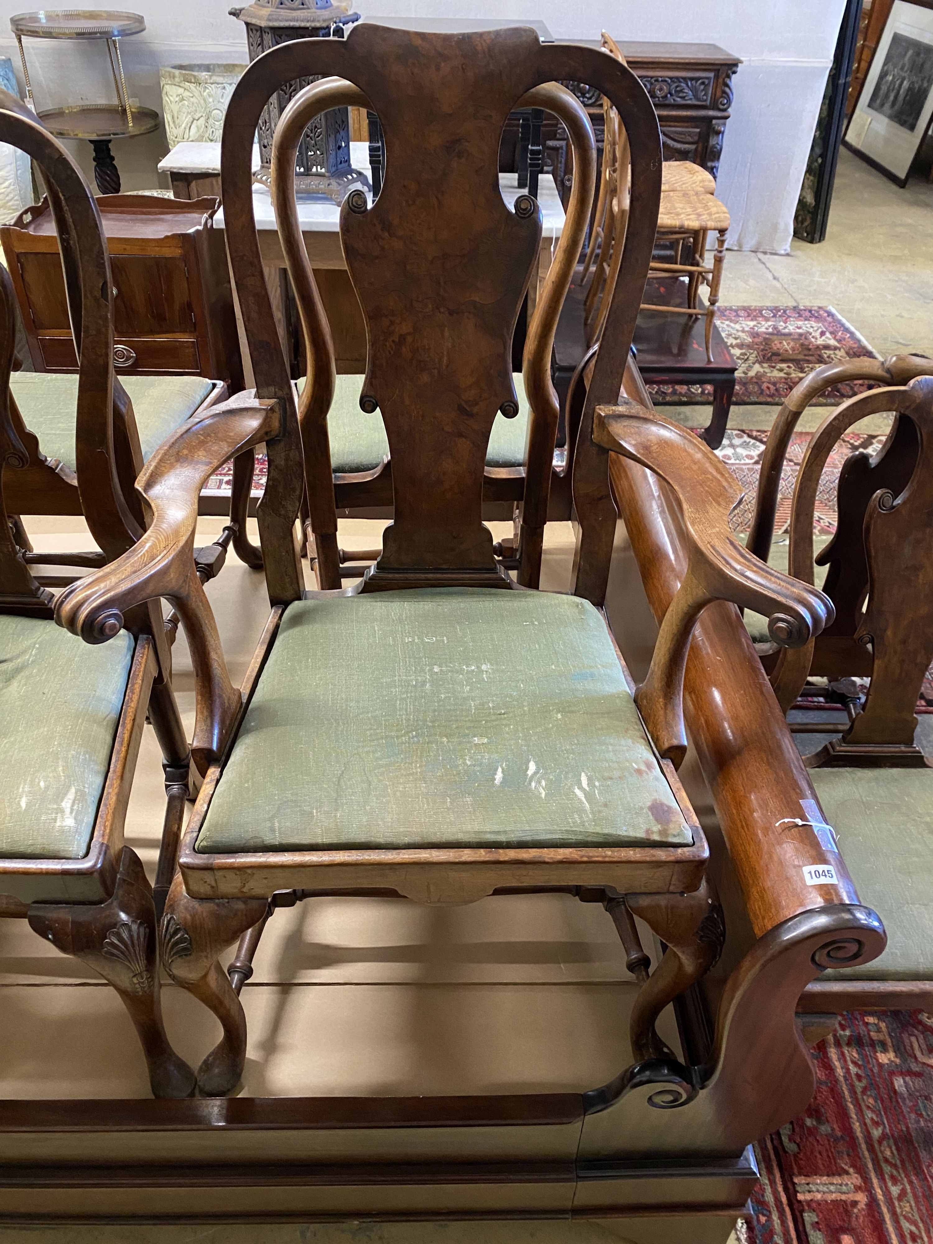 A set of eight George I style walnut dining chairs, two with arms.